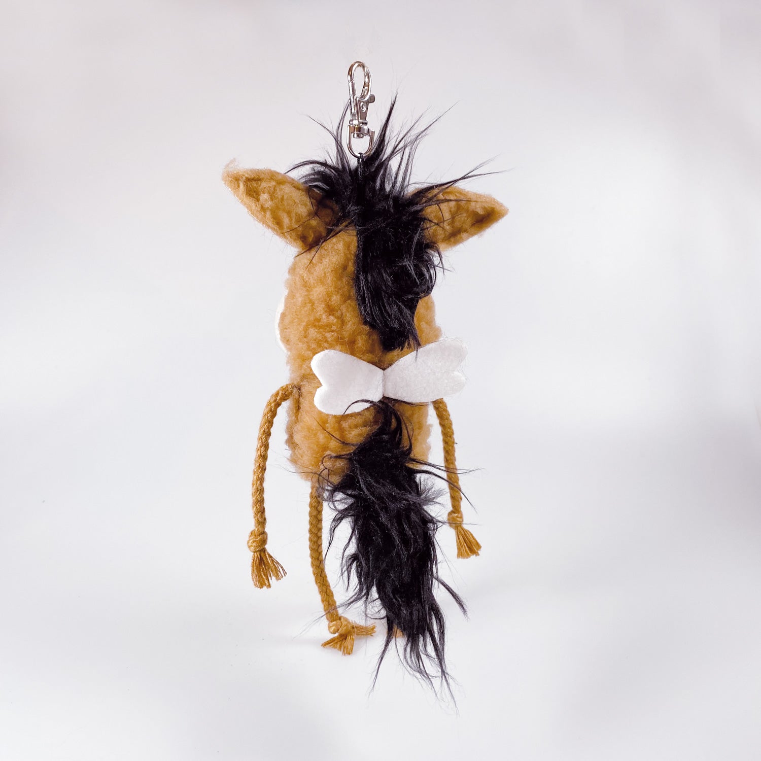 Soft toy pony in a bag “Luca”