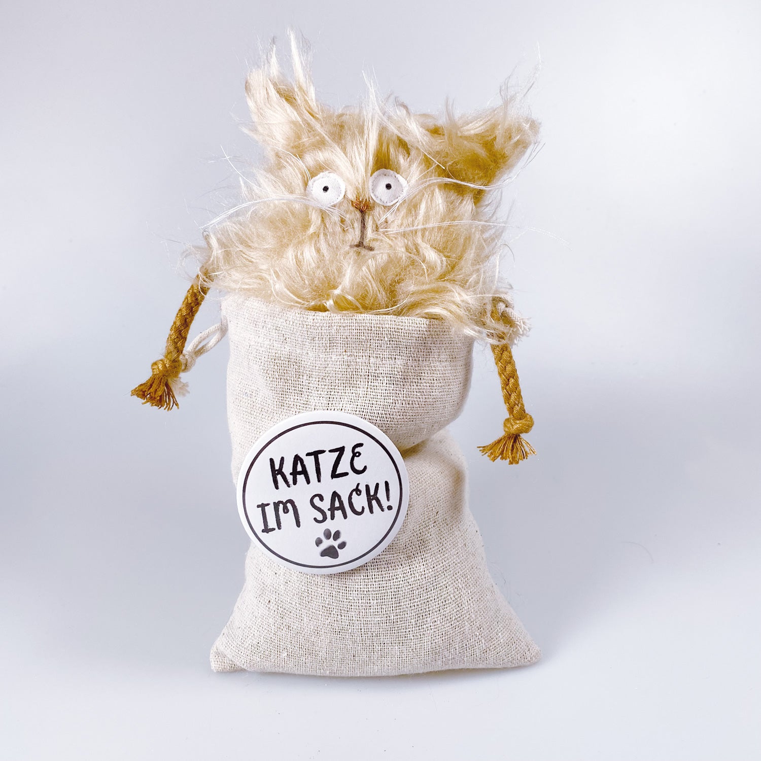 Cuddly toy cat in a bag “Curry”