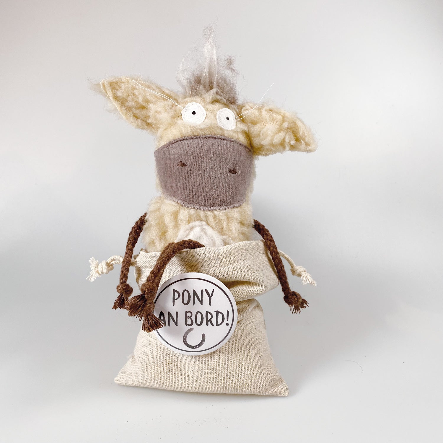 Soft toy pony in a bag “Dante”