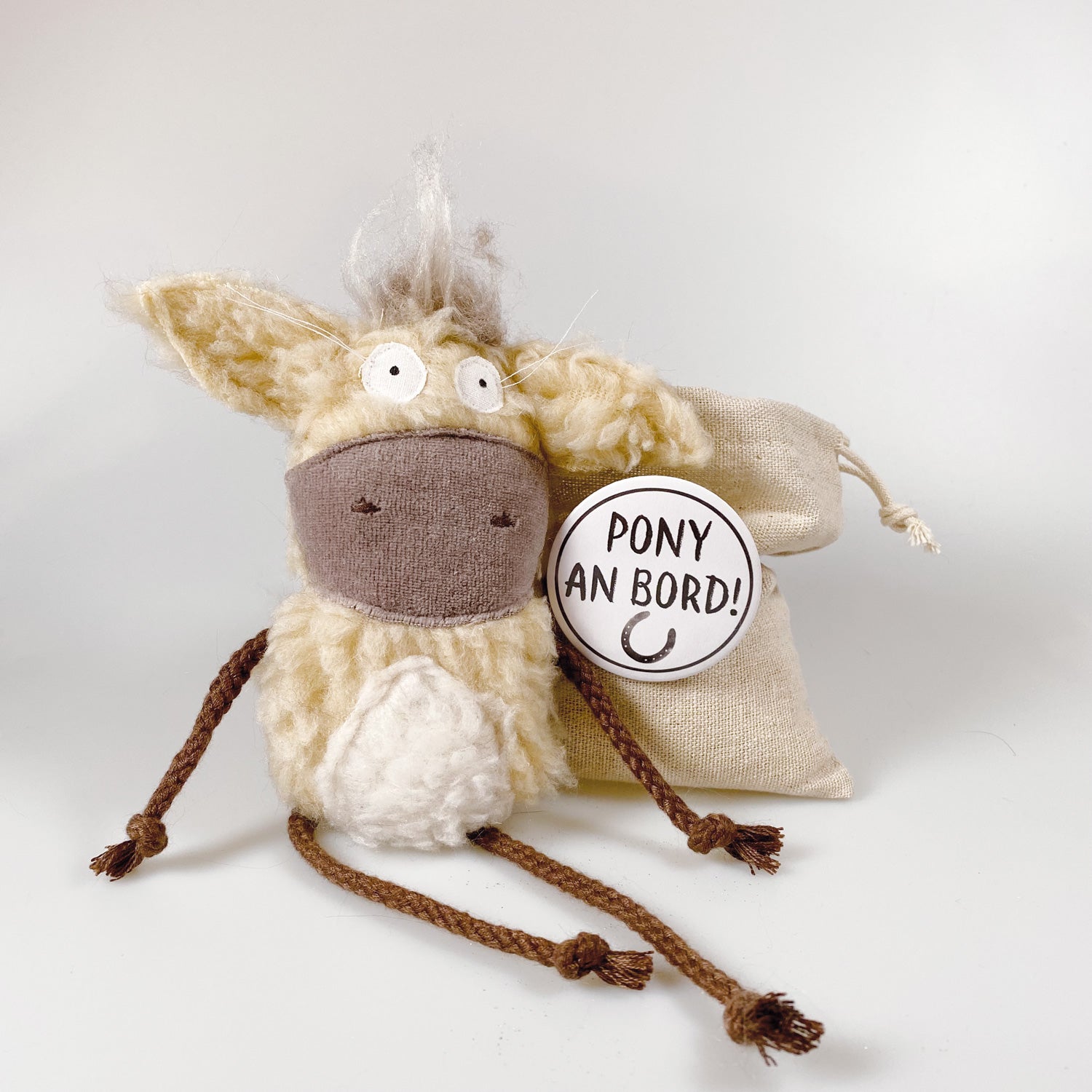 Soft toy pony in a bag “Dante”
